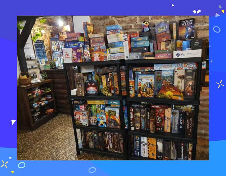 Game cafe in Central Europe with a stand of board games free to use